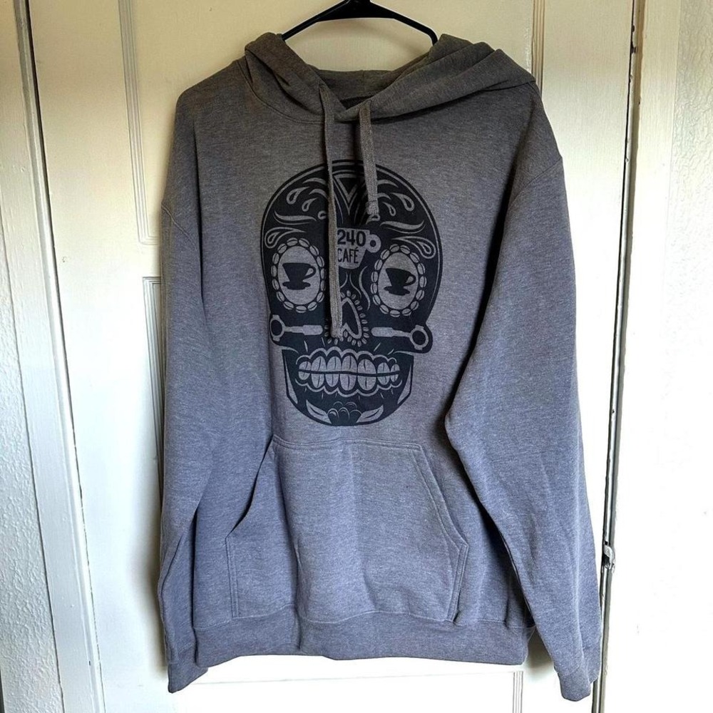 Cozy gray hoodie with bold black‎ sugar skull graphic — purchased in Baja